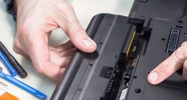 Use the battery reset pinhole